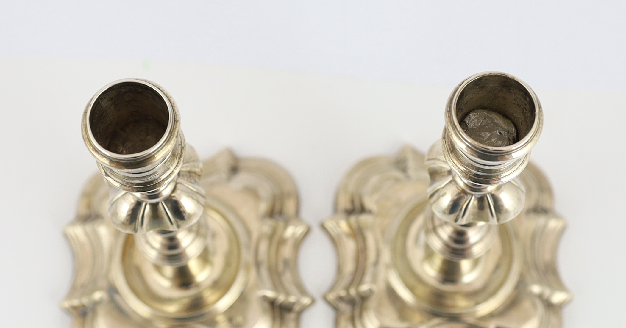 A pair of George II cast silver candlesticks, by Richard Gosling